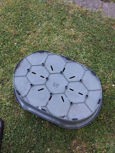 Small plastic dog bed.