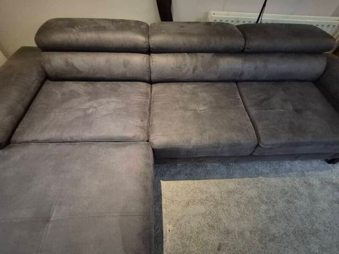 dark grey corner sofa with sleeping and storage