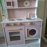 Wooden kitchen with kitchen toys Image 2