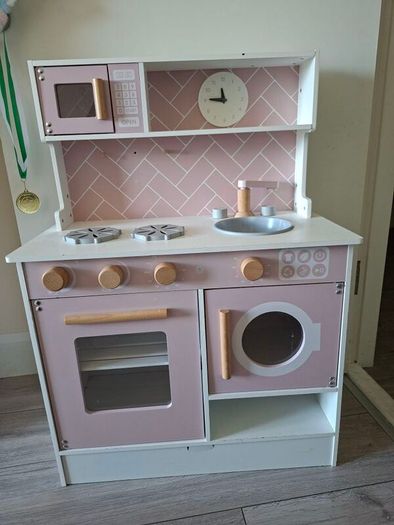 Wooden kitchen with kitchen toys