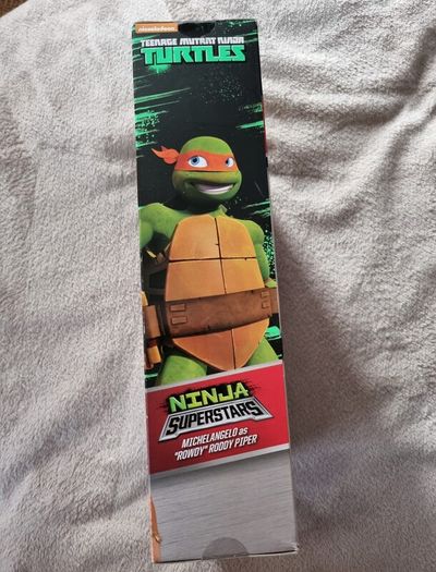 Ninja turtle Superstars Michelangelo / Miguel Angel Michelangelo Rowdy Piper Action Figure. Sealed. WWE Ninja Superstars