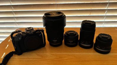 Canon EOS R series camera with 4 lenses and SmallRig cage