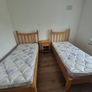 2x Solid Oak Single Beds incl mattress and bedside locker. Image 2