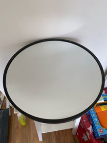 Round black mirror