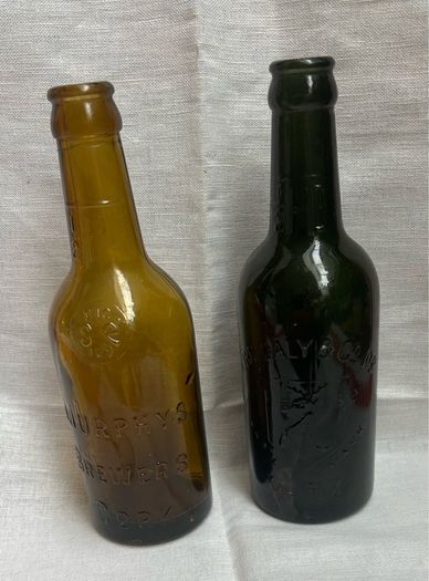 Antique Cork Advertising Bottles x2