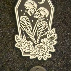 Skeletons , pin back badge.