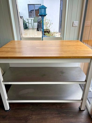 IKEA Free-standing kitchen island with foldable chairs.