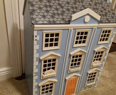 Wooden dolls house with furniture