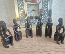 Set of 6 Vintage African Hand-Carved "Thinker" Figurines An excellent matching collection of vintage African "Thinking Man" sculptures. Each individual piece is uniquely hand-carved out of a single block of dark hardwood with a lovely smooth, polished fin