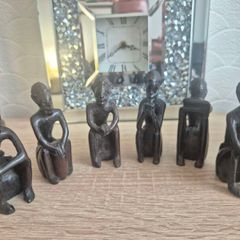 Set of 6 Vintage African Hand-Carved "Thinker" Figurines An excellent matching collection of vintage African "Thinking Man" sculptures. Each individual piece is uniquely hand-carved out of a single block of dark hardwood with a lovely smooth, polished fin