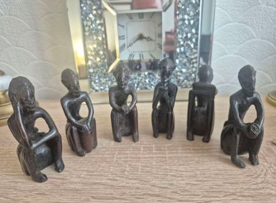 Set of 6 Vintage African Hand-Carved "Thinker" Figurines An excellent matching collection of vintage African "Thinking Man" sculptures. Each individual piece is uniquely hand-carved out of a single block of dark hardwood with a lovely smooth, polished fin