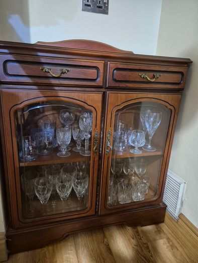 Wooden display cabinet with glass doors