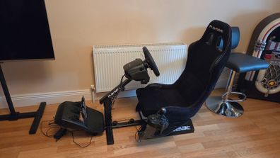 Playseat racing rig with Logitech G29 steering wheel and shifter