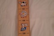 Wooden height rule/chart