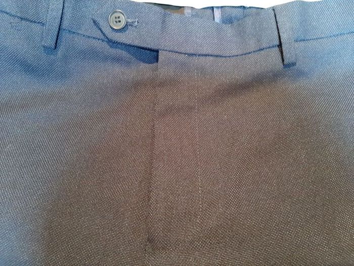 New navy trousers tag attached