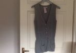 Sleeveless cardi with two patch pockets. Bought at carriage Donna.