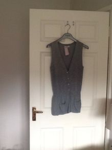 Sleeveless cardi with two patch pockets. Bought at carriage Donna.