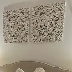 Two large wall art pieces