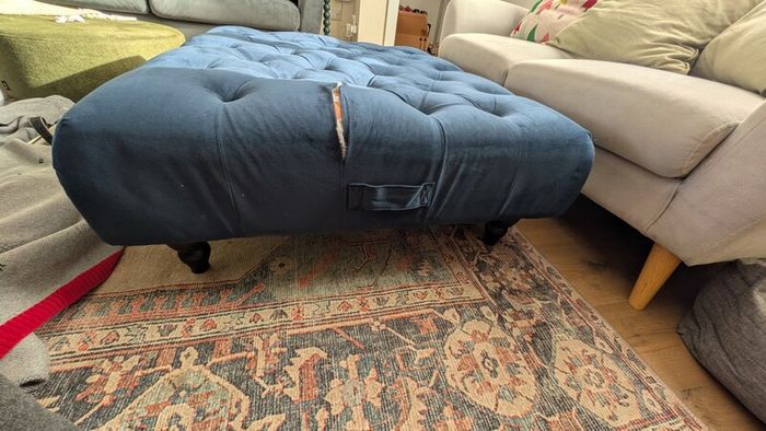 Navy footstool/ottoman from Next. Good condition. Material has rip so needs repair or reupholstery.