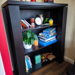 Bookcase shelving unit from black wood veneer