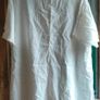 Off white linen button-down  longline tunic featuring a relaxed, oversized silhouette. Image 5