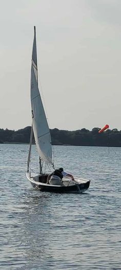 Laser 13 sailboat with road and launching trailer
