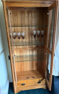 Solid oak display cabinet with glass shelves