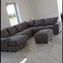 Large L shaped couch with foot stool Image 6