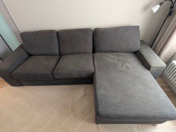 IKEA KIVIK 3-seater sofa with chaise in dark grey.