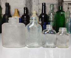 311 - Set of 4 Vintage Decorative Collectible Clear Glass Bottles