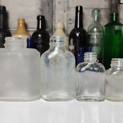 311 - Set of 4 Vintage Decorative Collectible Clear Glass Bottles