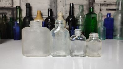 311 - Set of 4 Vintage Decorative Collectible Clear Glass Bottles
