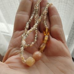Necklace made of beads and glass beads.
