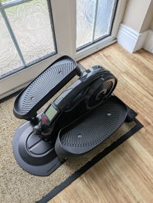 YYFITT under-desk elliptical / pedal exerciser.