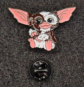 Gremlin,  pin back badge.