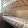 White bunk bed and mattresses Image 4
