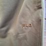 New FILA olive green athletic track pants with an elastic drawstring waistband and zippered ankle hems. Image 2