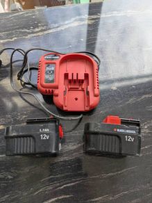 Black and Decker charger and 2 12v batteries