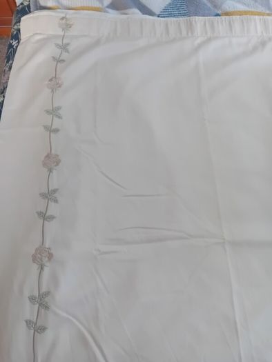 A pair of vintage embroidered curtains