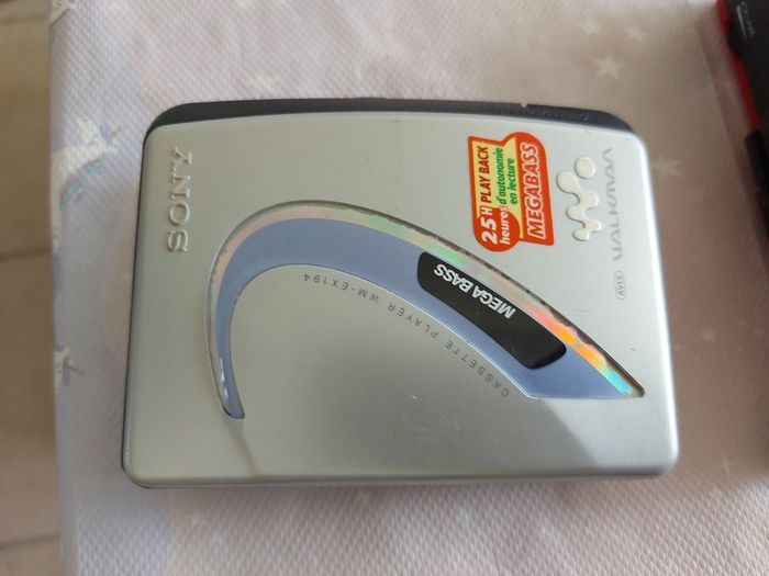 Sony Walkman and Sanyo AM-FM Stereo cassette Player, excellent cosmetic condition, no cables or batteries