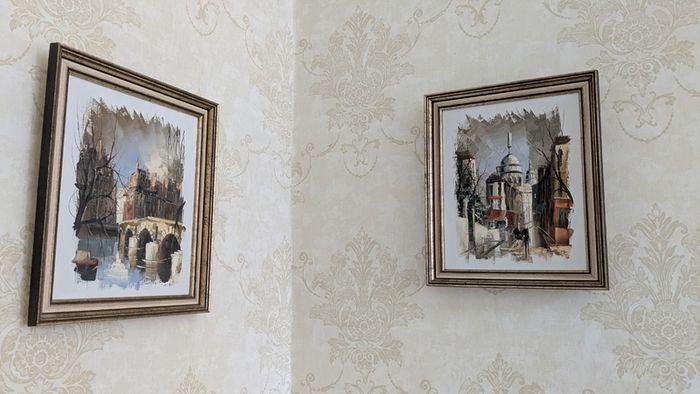 Pair of framed Parisian city scene prints