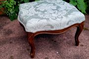 Antique upholstered footstool