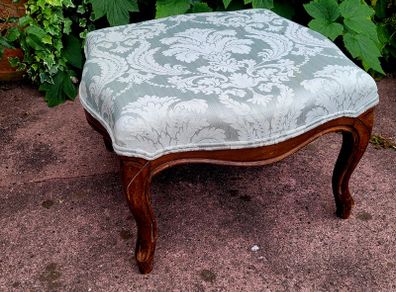 Antique upholstered footstool