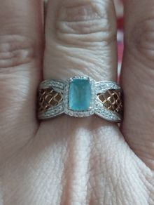 A classic ring with a  grandidierite and stones, crafted from 925 sterling silver with a platinum finish.