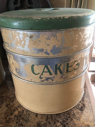 selection of vintage cake storage tins with lids
