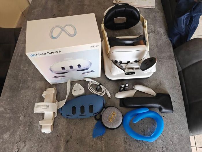 Meta Quest 3 with charging dock, rechargeable batteries, extra lenses, the back strap