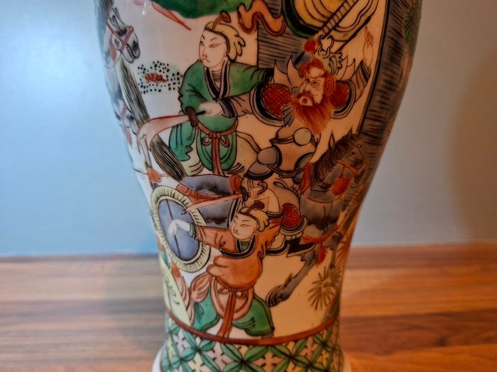 A late 19th century Chinese large famille verte vase, decorated with Chinese figures 32cm