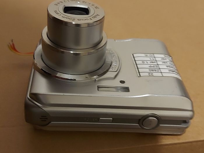 Z880 Digital Camera, Takes 2AA Batteries, working fine, has a modification that doesn't affect its performance