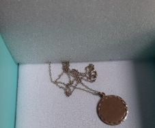Gold disc and chain