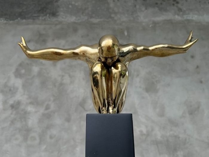 Large bronze statue on custom stand